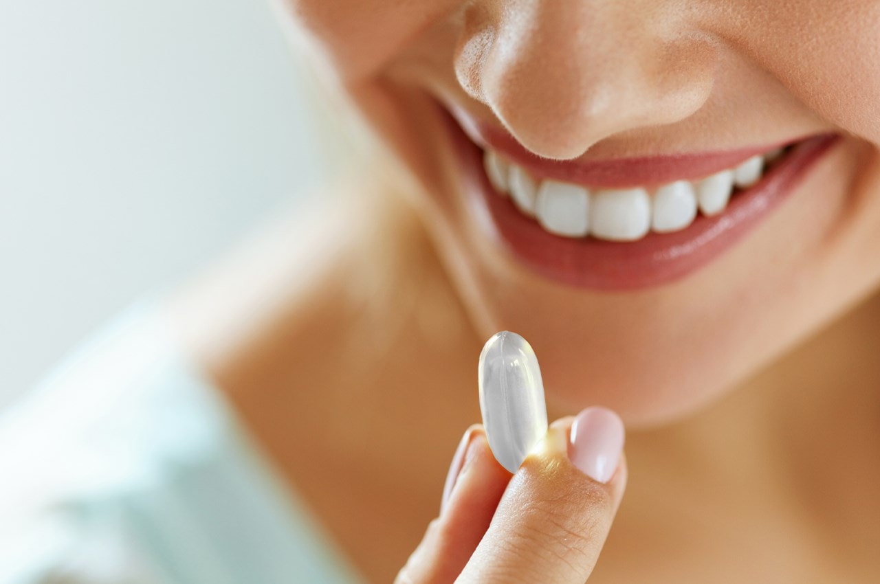 Woman taking probiotic