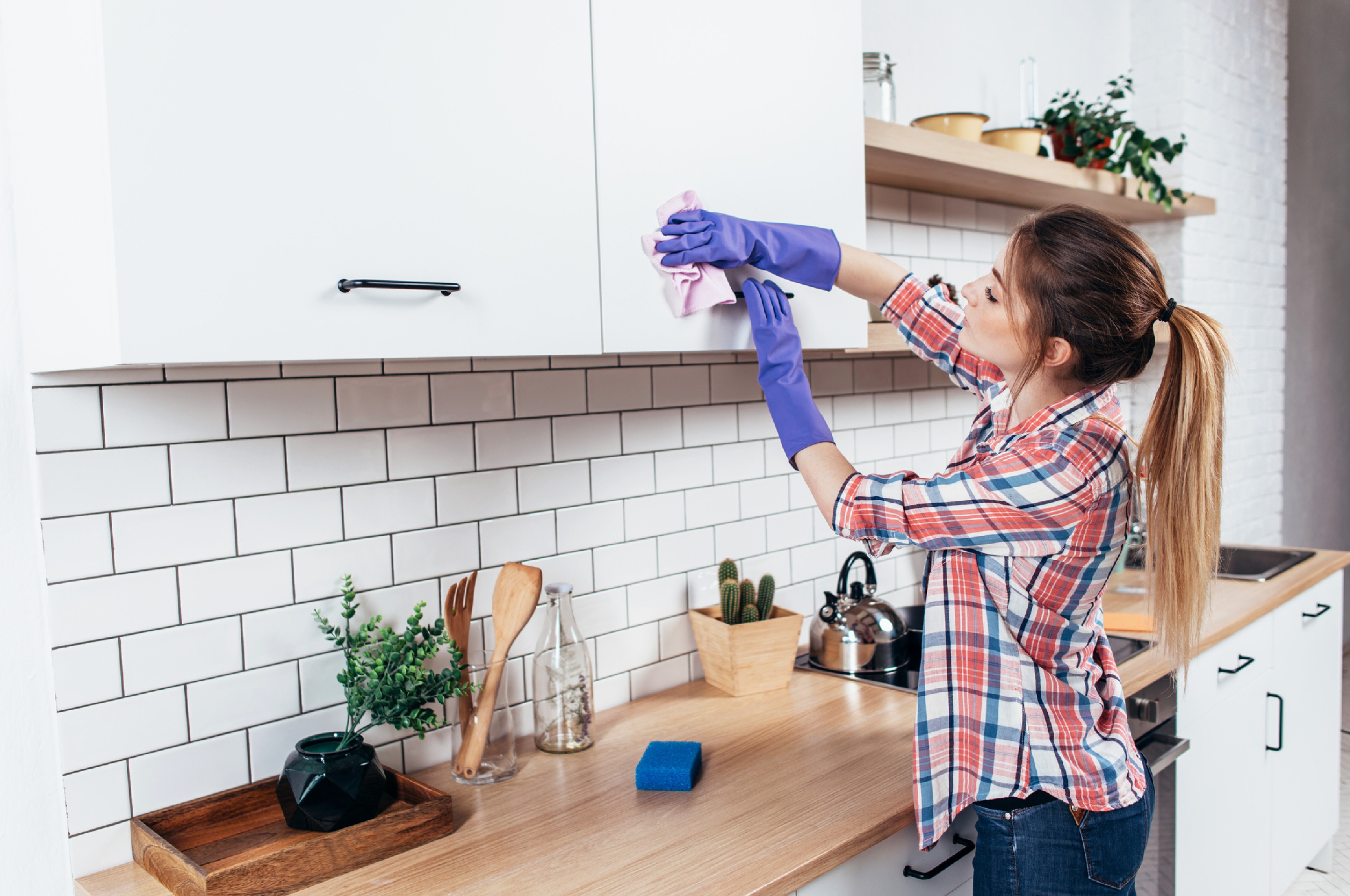 lady cleaning kitchen