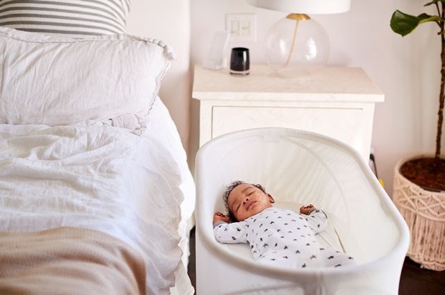 Baby asleep in a cot