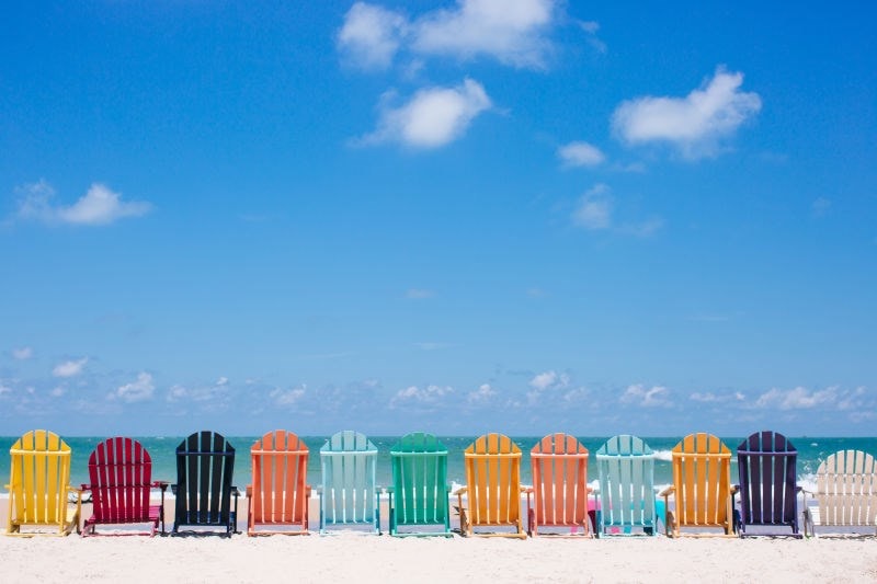 Beach scene with multi-coloured chairs