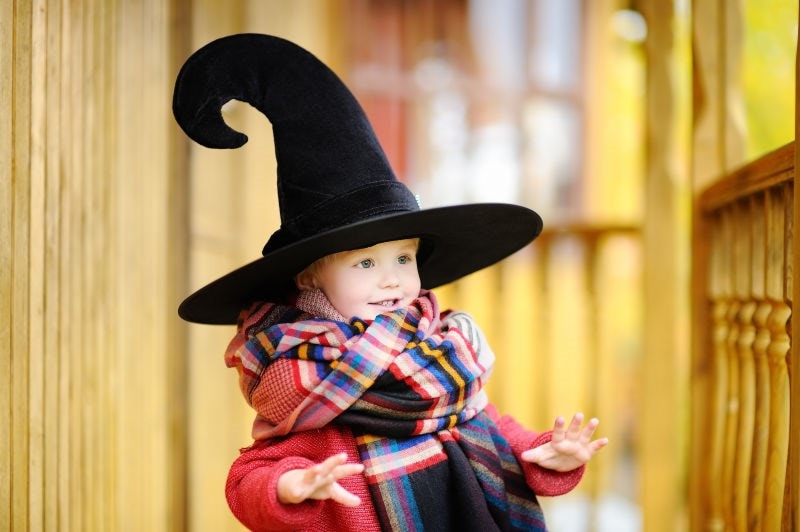 child wearing wizard hat